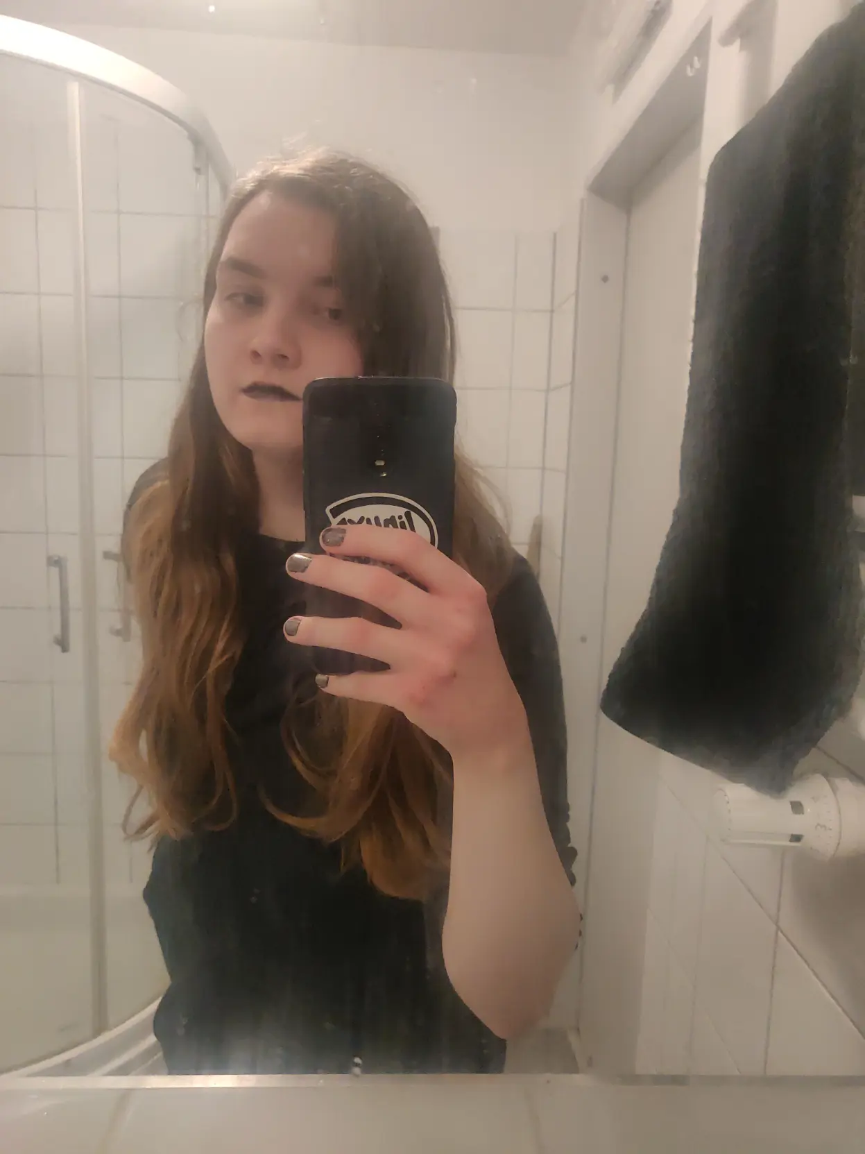 Another selfie this time in a mirror, shows me in my hoodie with black lipstick and my black  and pink glitter nails