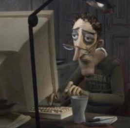 Tired guy in front of a computer